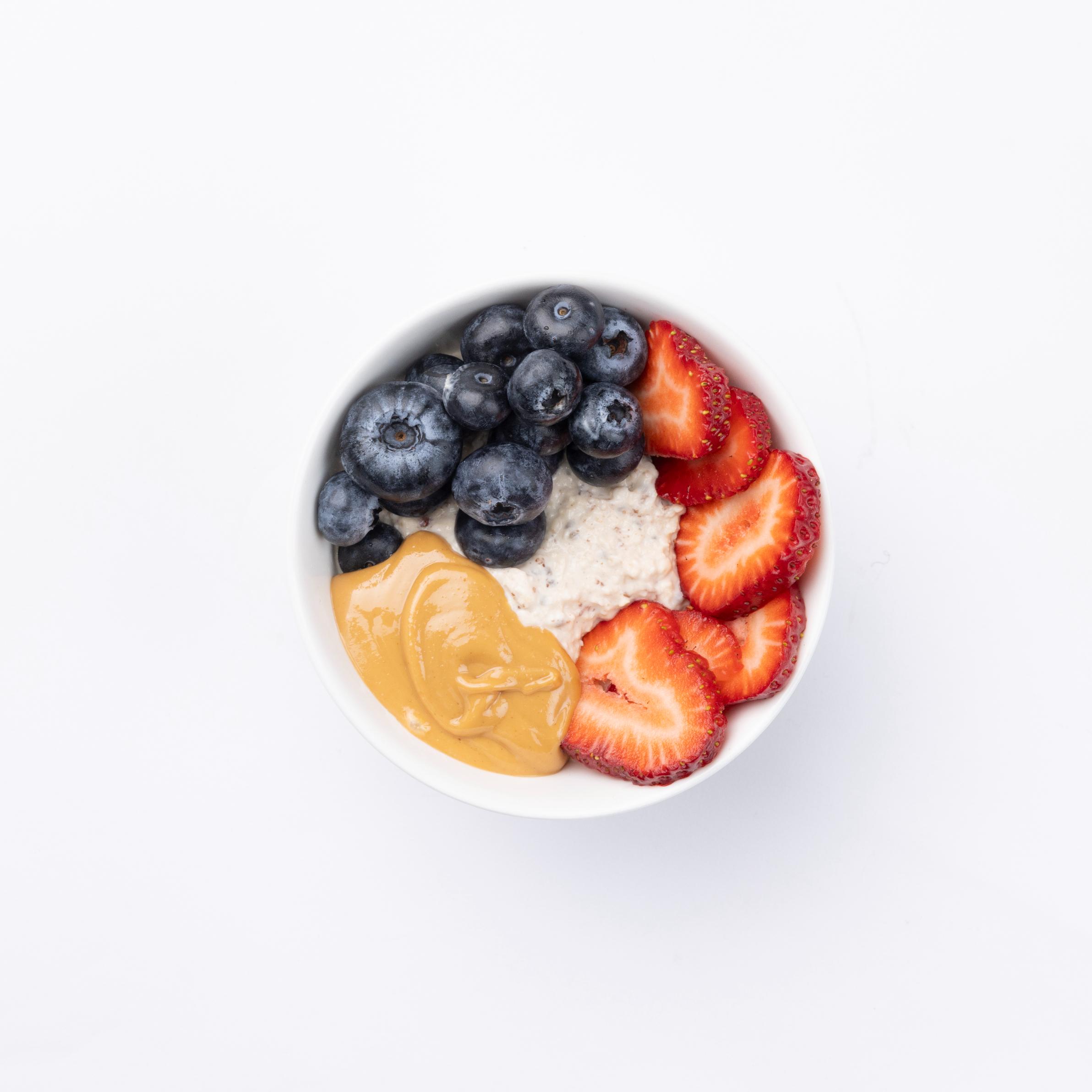 PUR overnight oats GF Oats, Almond Butter + Strawberries/blueberries, chia seeds, coconut flakes