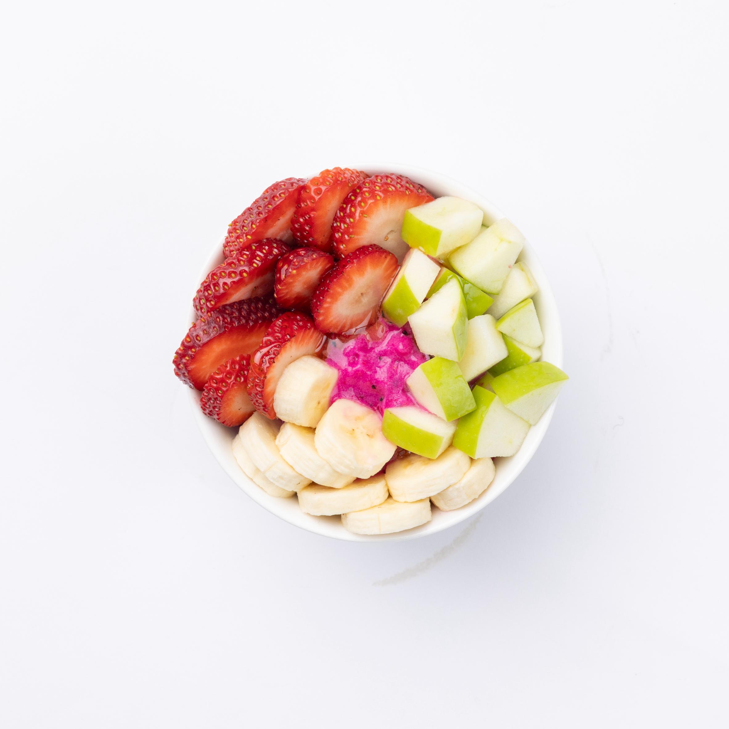 dragon power Pitaya, Strawberry, Banana, Granny Smith Apple blended together and topped with Strawberries, Bananas, Granola, Almond Butter, Honey