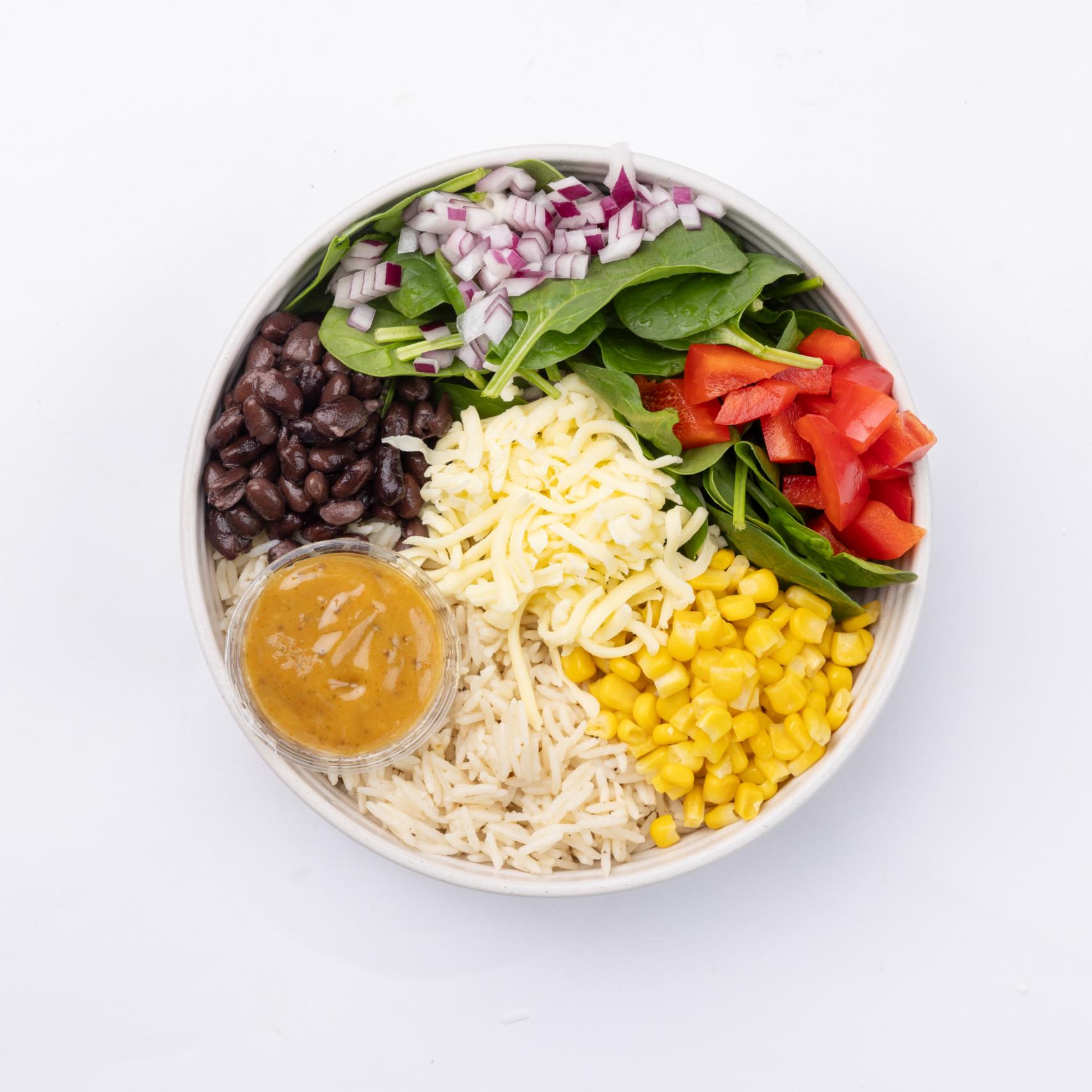 BBQ bowl Spinach, wild rice, chicken, black beans, corn, onions, white cheddar, homemade BBQ