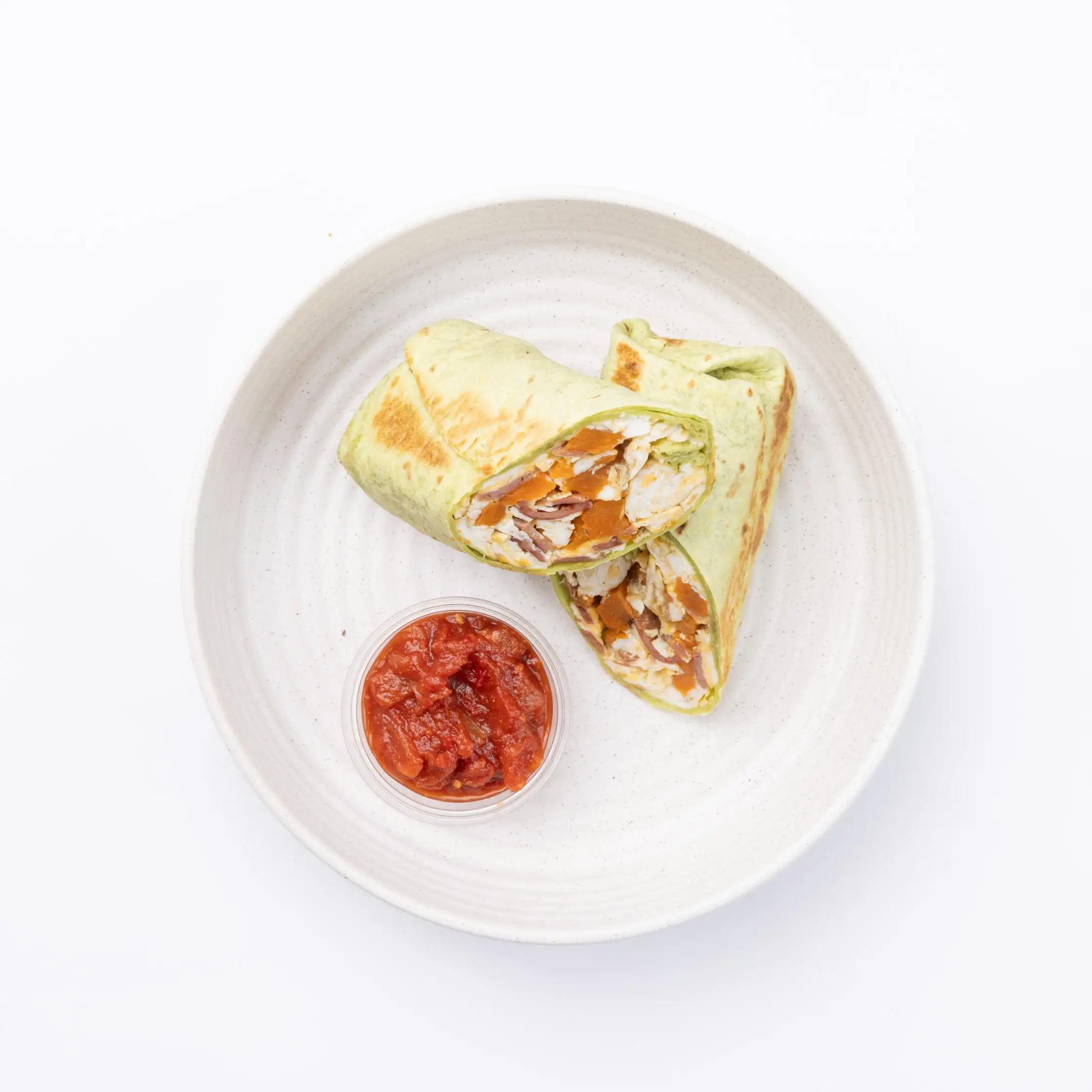 Turkey Bacon Egg Wrap Egg, Turkey Bacon, Sweet potato, Spinach, Feta cheese, Avocado, Roasted salsa in the side
