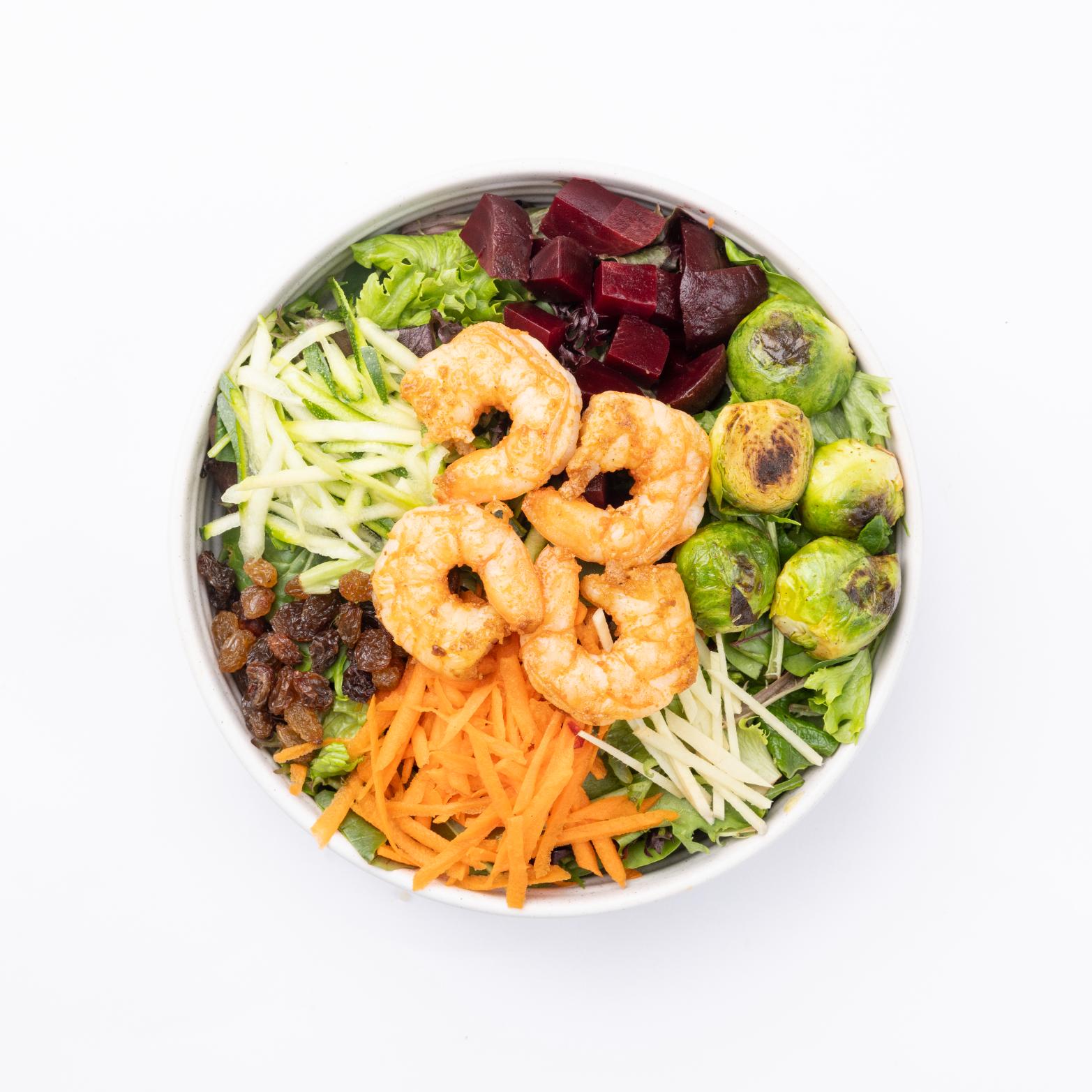 North Shore Detox Mixed greens, carrots, red beets, shrimp, zucchini ribbons, grated ginger, Brussel sprouts, raisins, balsamic vinaigrette